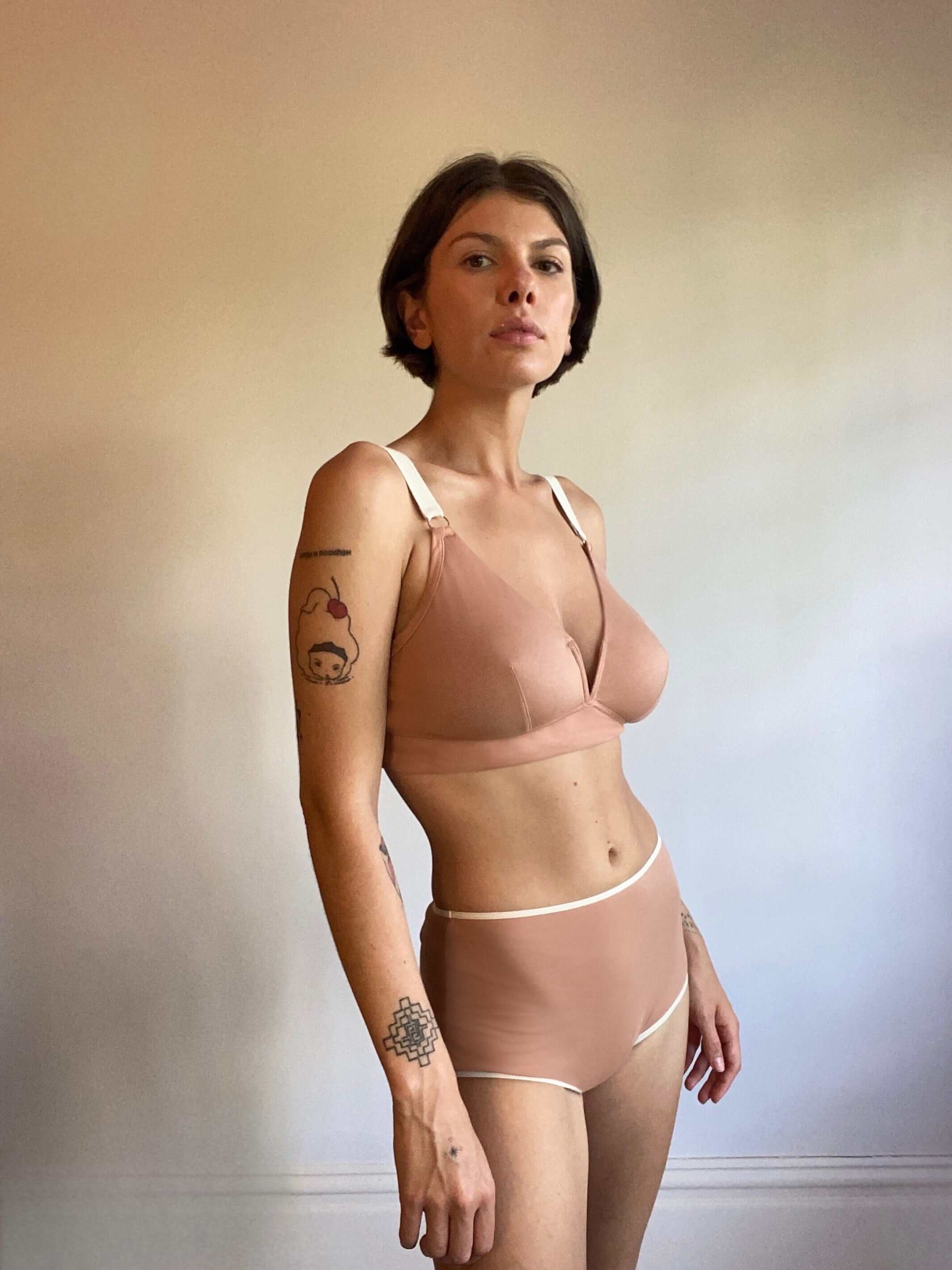 woman wearing nude bra with wide straps and matching briefs