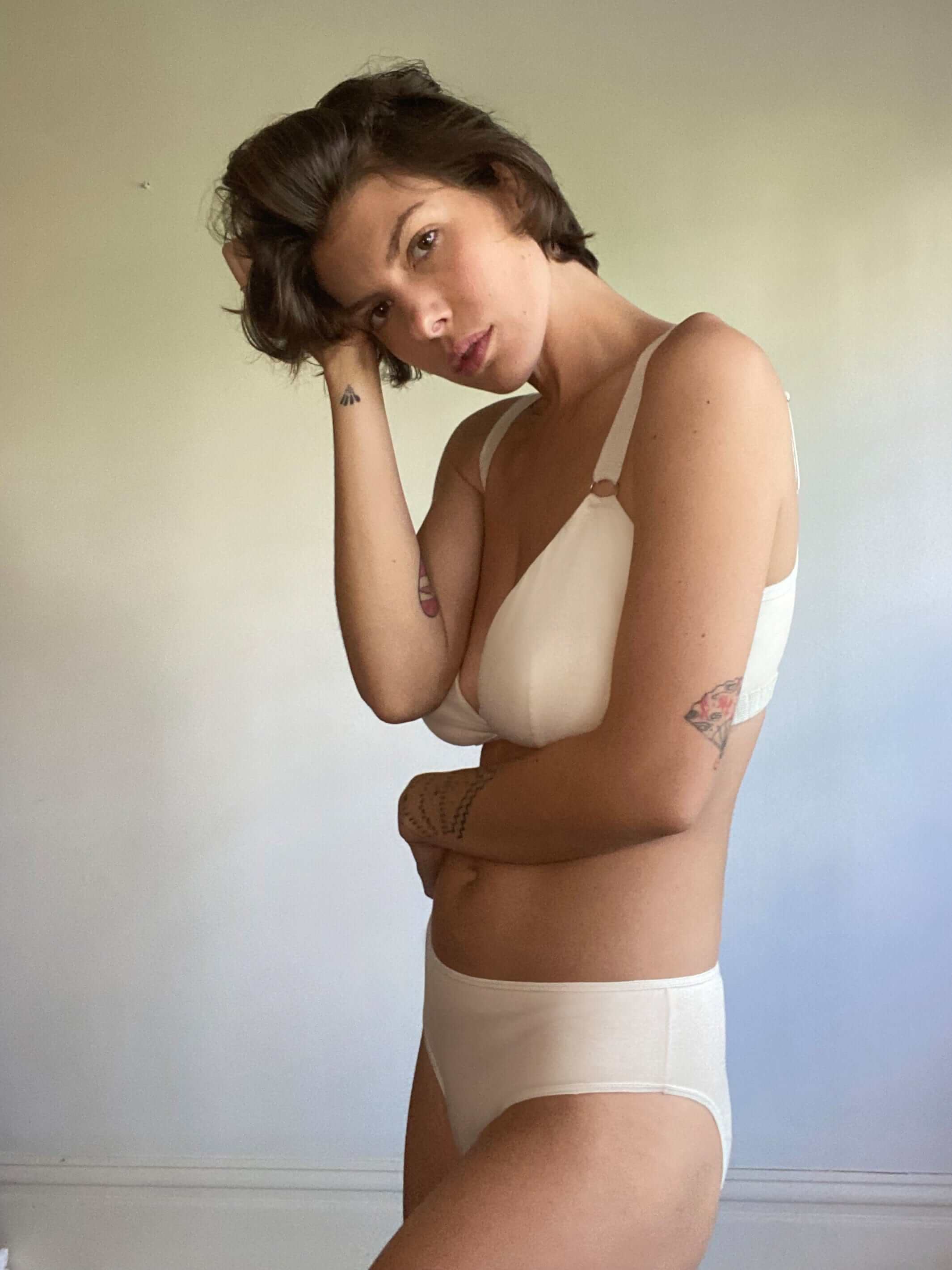 woman wearing an organic cotton nursing bra and matching organic cotton underwear