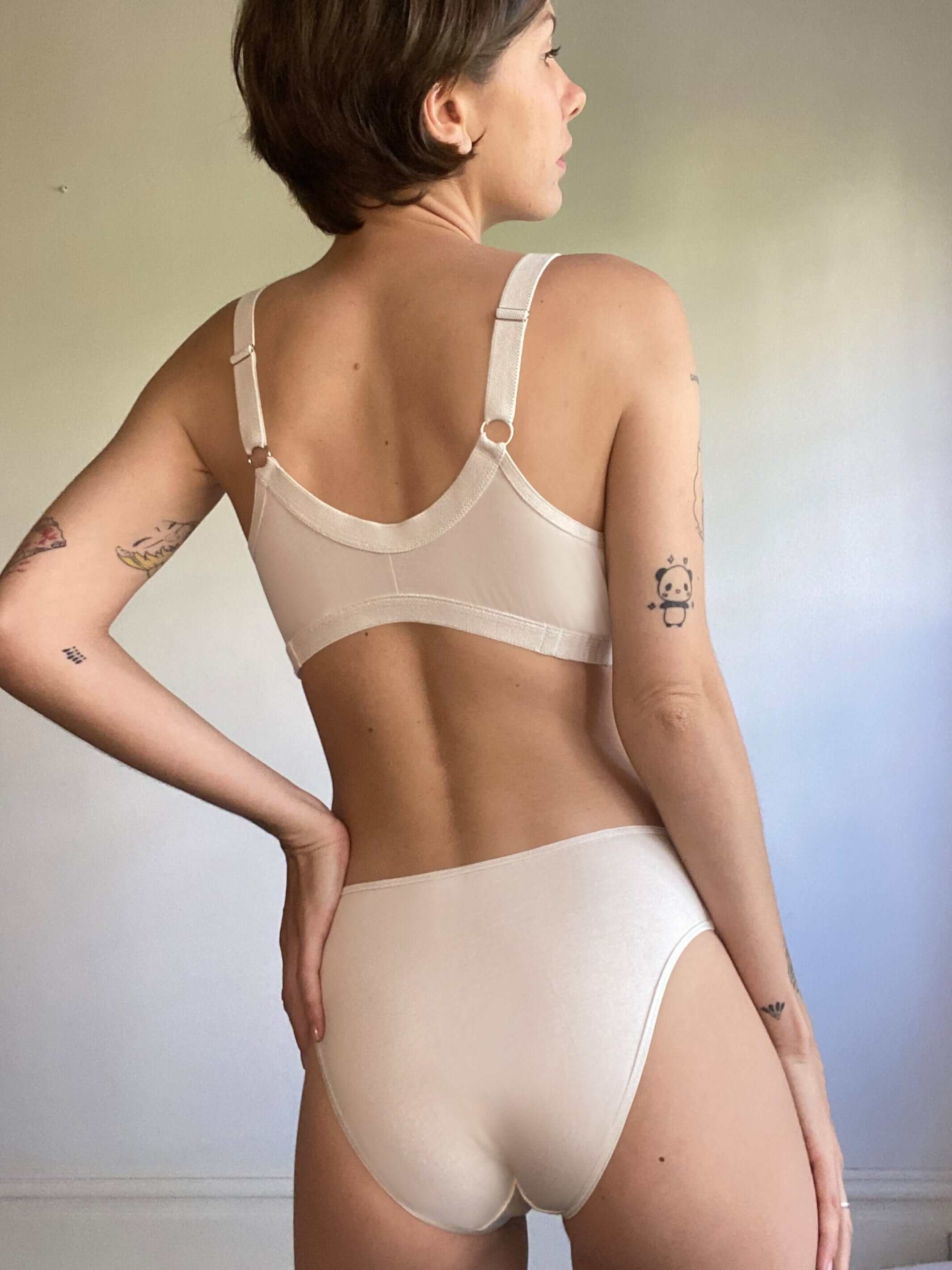 woman wearing an organic cotton nursing bra and matching organic cotton underwear