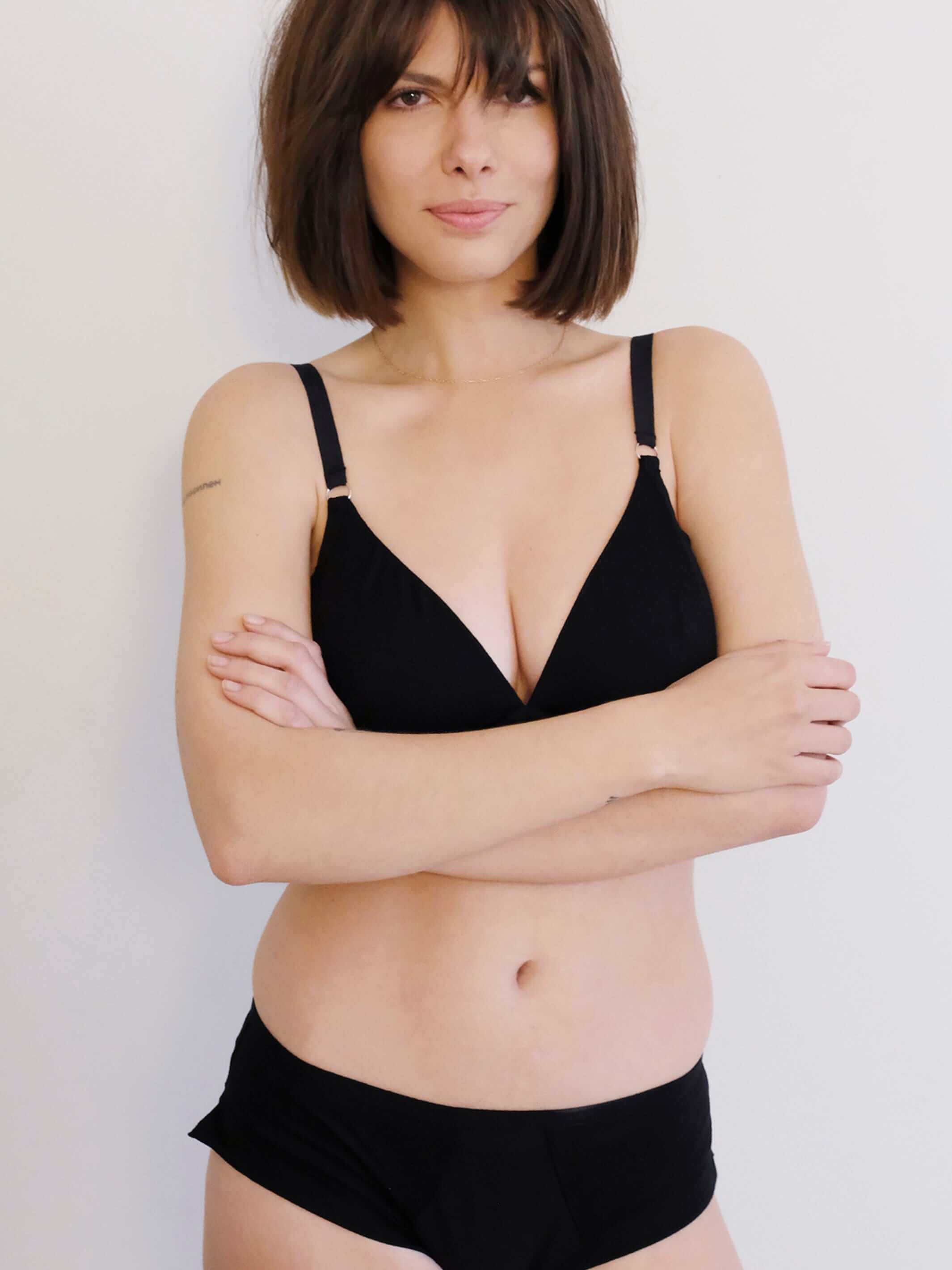 woman wearing black longline  bra made from tencel, with matching tencel underwear