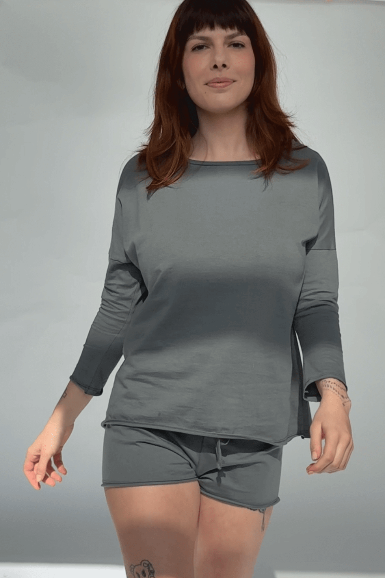 Long sleeve tee and shorts in grey, front view on model