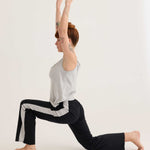 Secret shelf singlet worn in a yoga pose