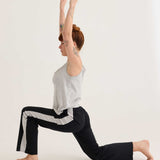 Secret shelf singlet worn in a yoga pose