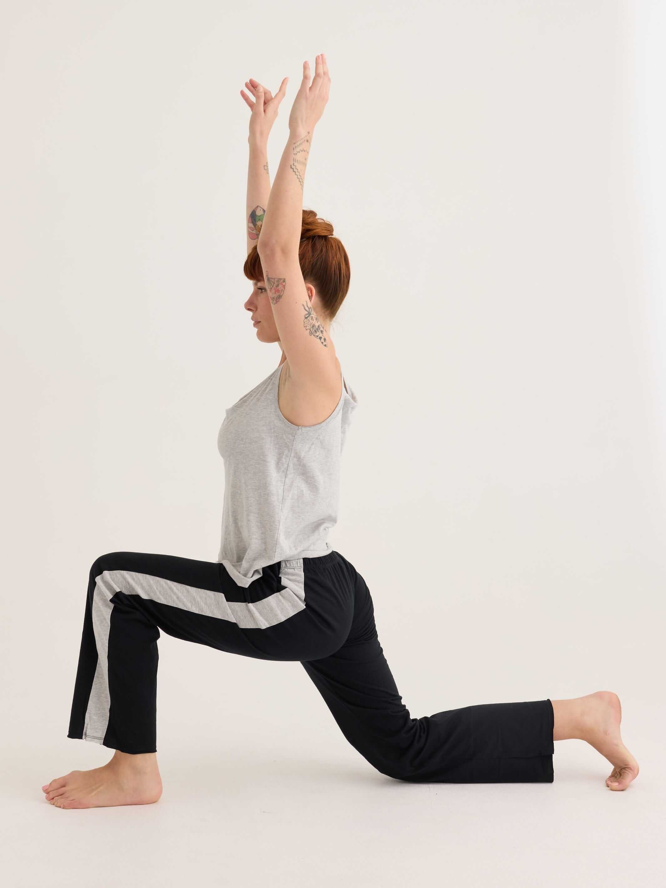 Secret shelf singlet worn in a yoga pose
