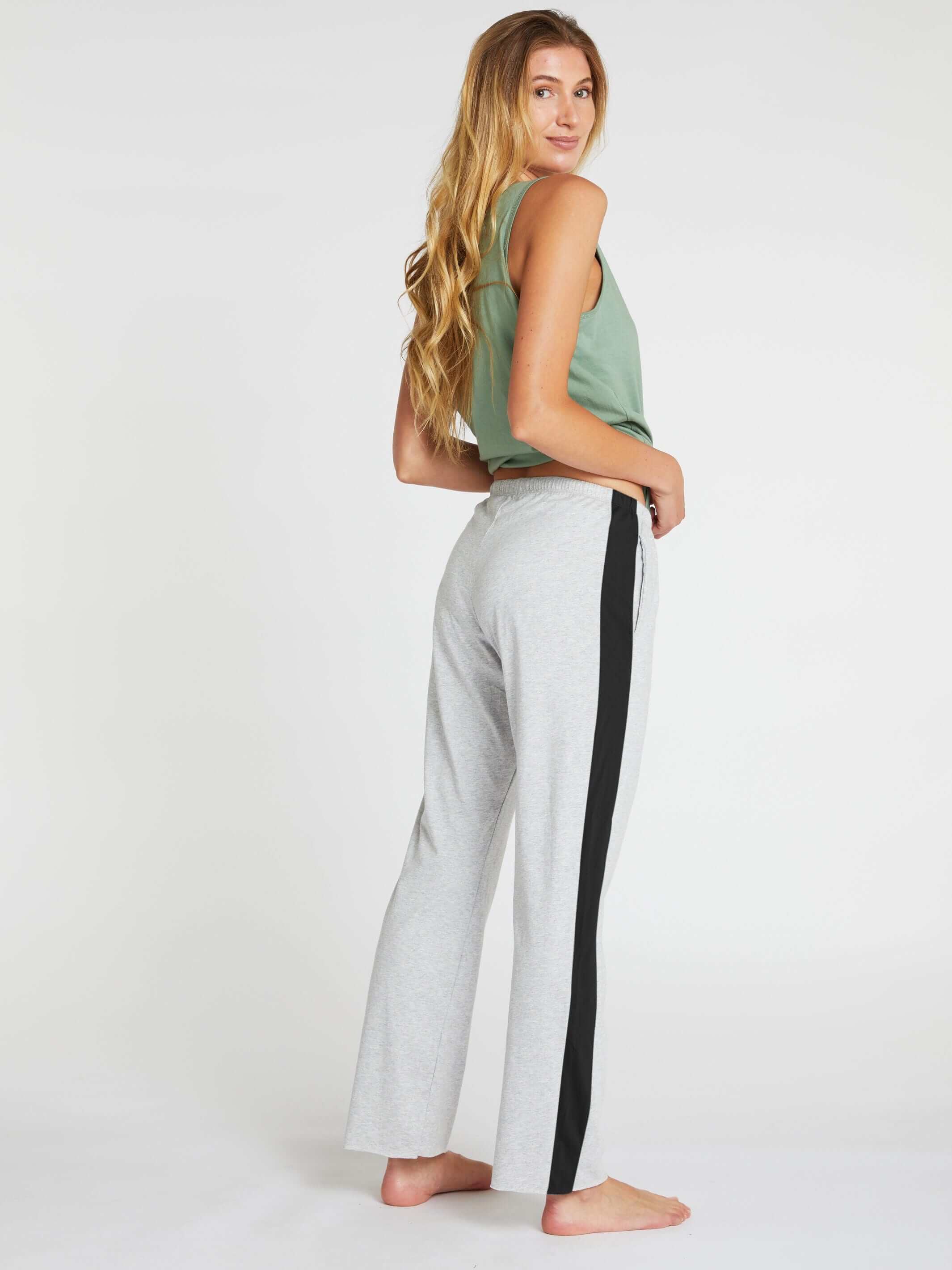 woman wearing organic cotton bra singlet and womens long cotton pants