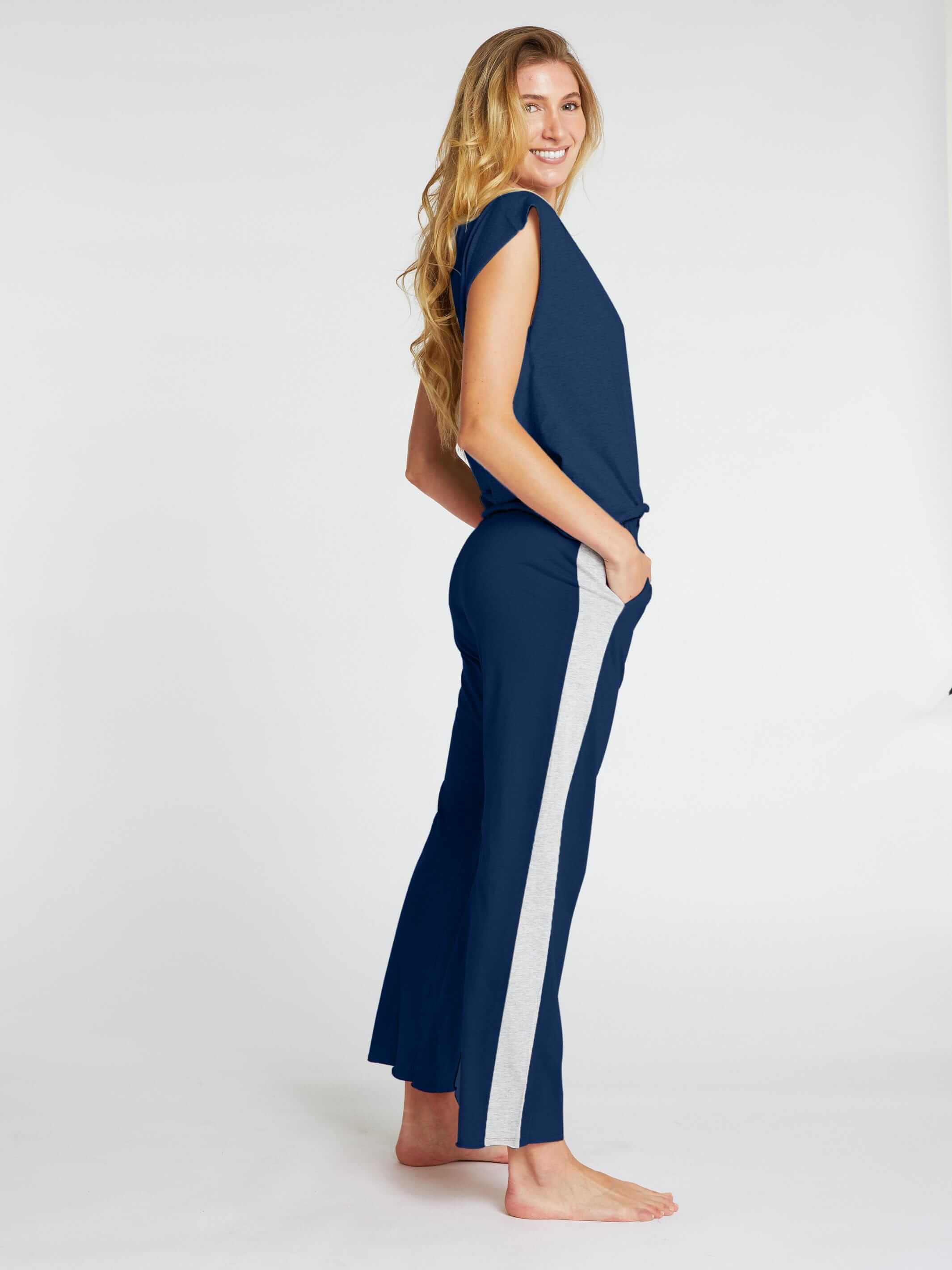 woman wearing navy womens organic cotton t shirt and womens long cotton pants