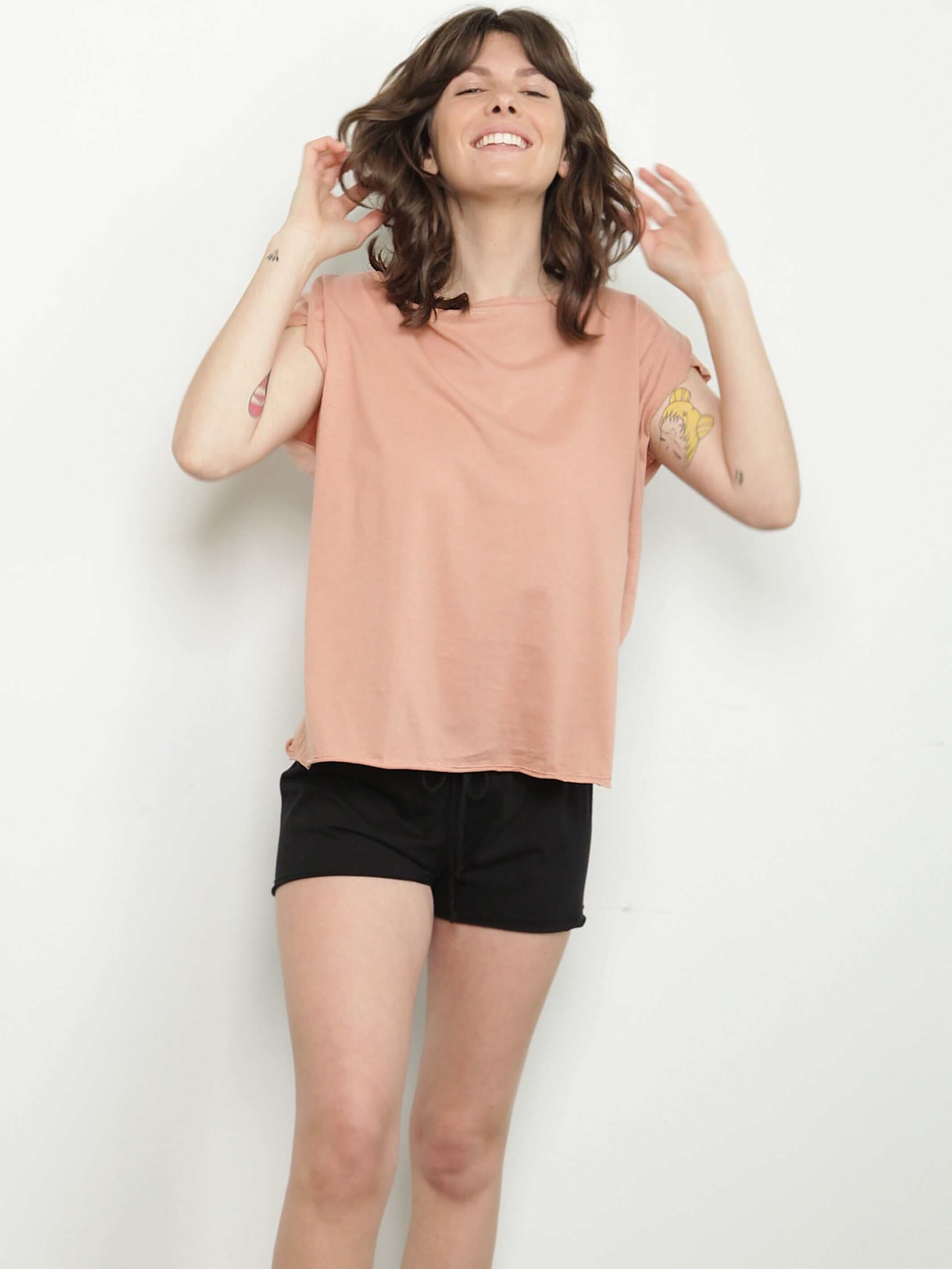 woman wearing hazel womens t shirt and black organic cotton shorts