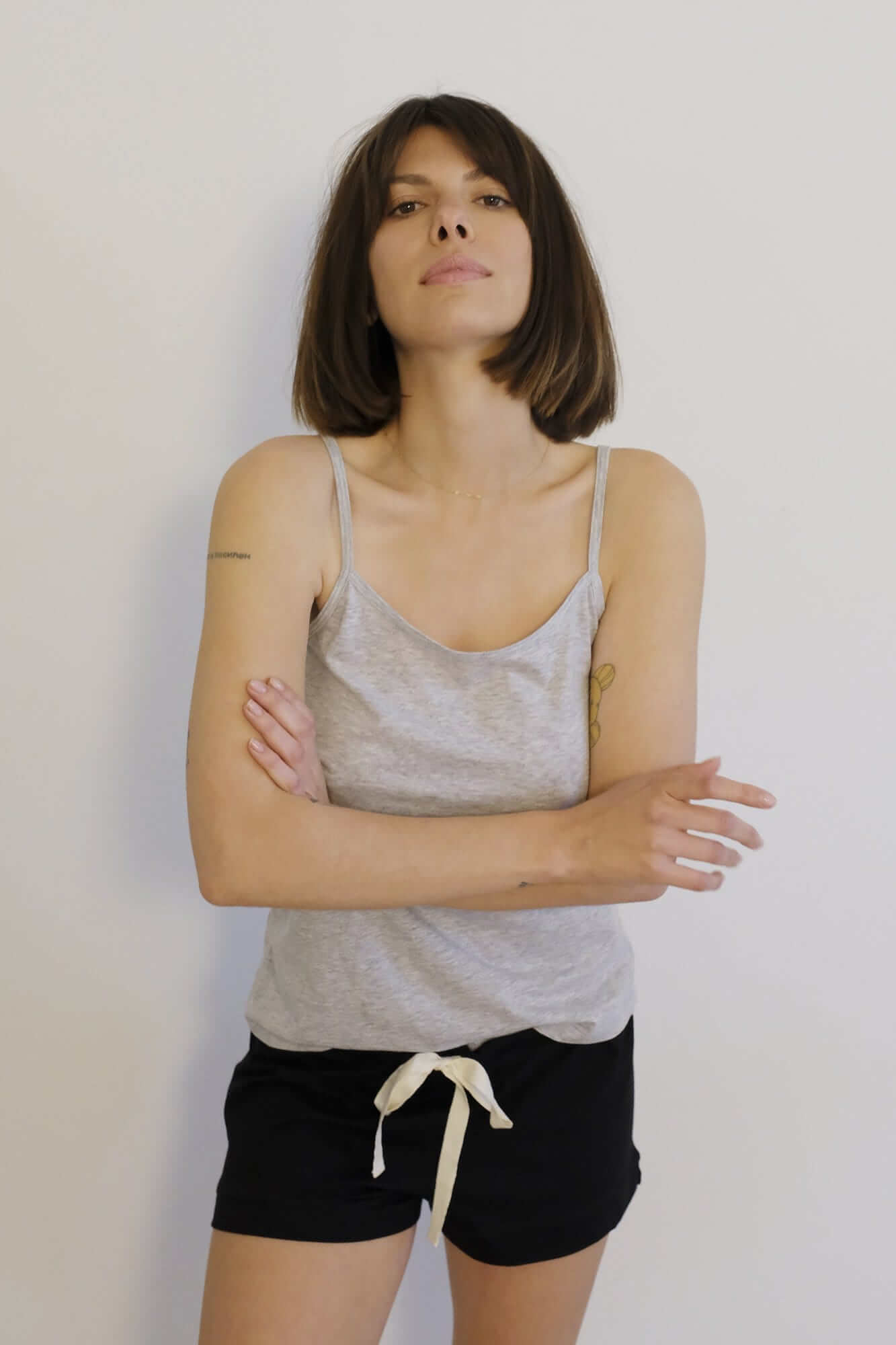 Woman wearing grey marle organic cotton singlet