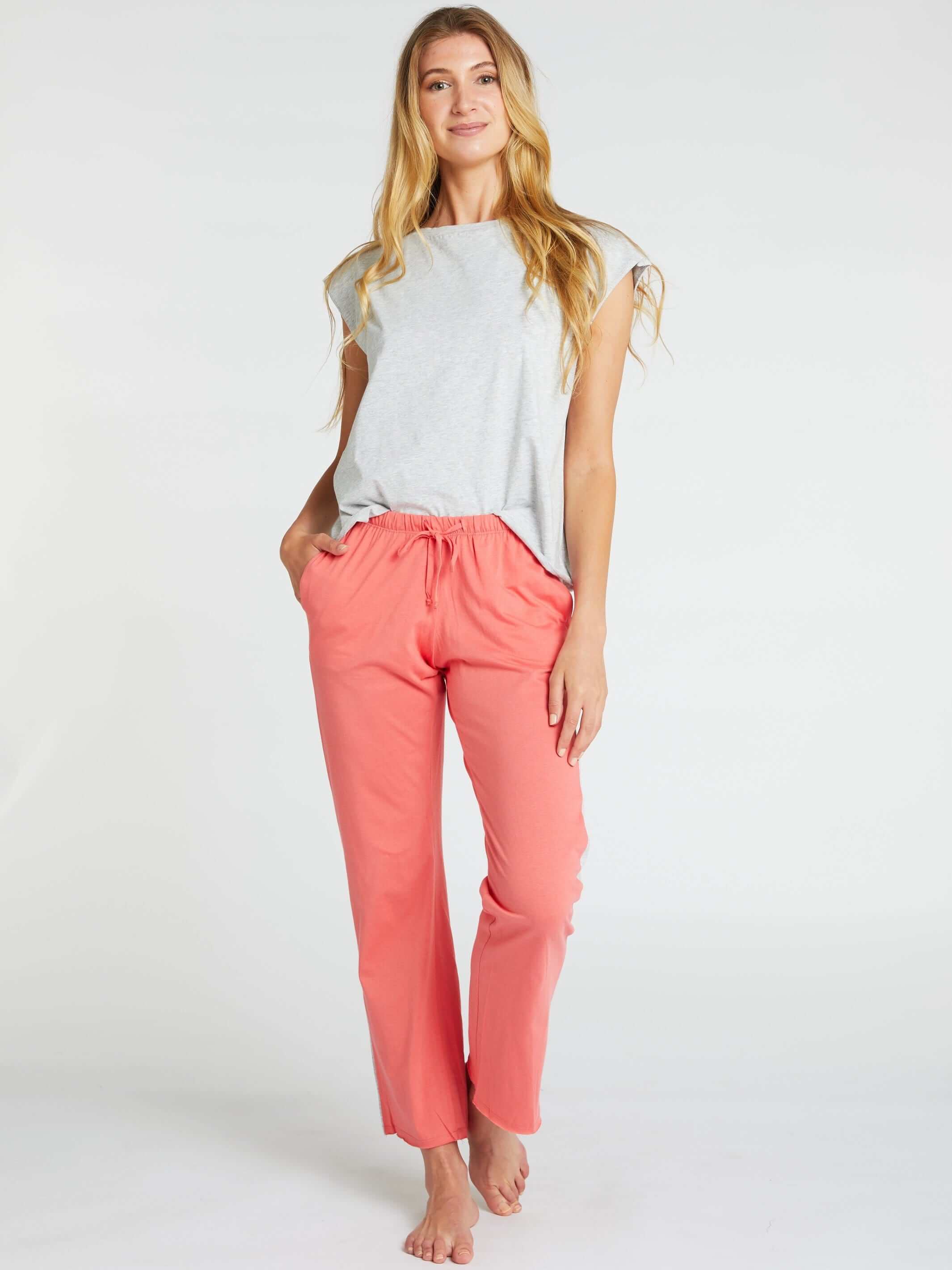 woman wearing grey marle womens organic cotton t shirt and womens long cotton pants in poppy colour