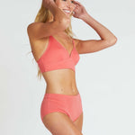 woman wearing poppy red bra and matching high waist briefs in organic cotton