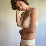 woman wearing an organic cotton nursing bra and matching organic cotton underwear