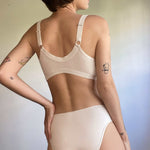 woman wearing an organic cotton nursing bra and matching organic cotton underwear